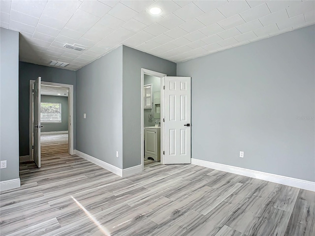 unfurnished bedroom featuring light hardwood / wood-style flooring