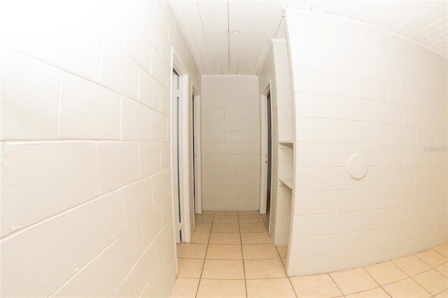 hallway featuring light tile patterned floors