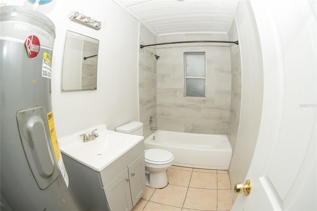 full bathroom featuring vanity, electric water heater, tile patterned floors, tiled shower / bath combo, and toilet