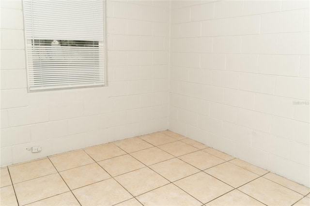 unfurnished room with light tile patterned floors