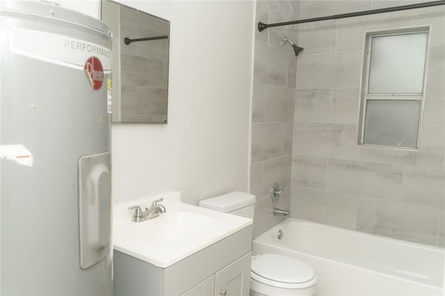 full bathroom with vanity, toilet, tiled shower / bath, and water heater