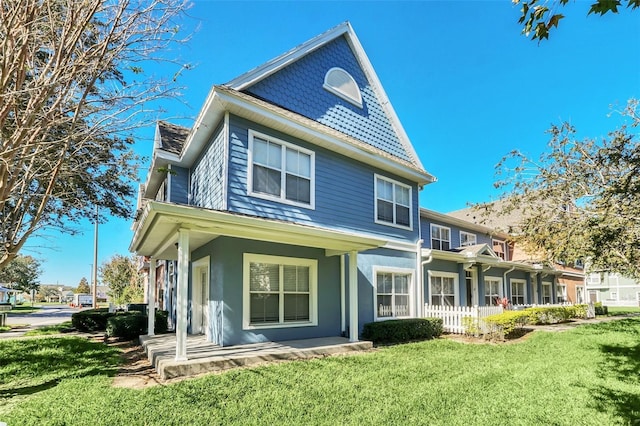 rear view of property with a yard