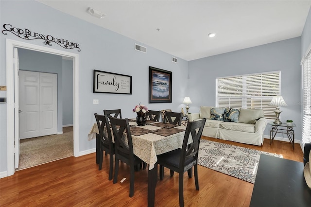 dining room with hardwood / wood-style floors