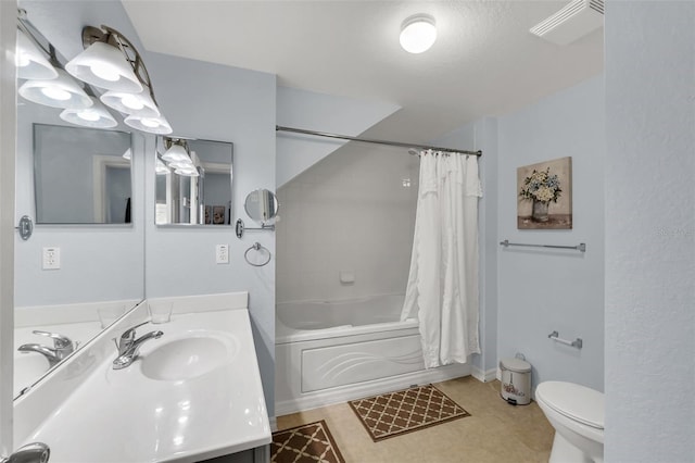 full bathroom with vanity, toilet, and shower / bath combo with shower curtain