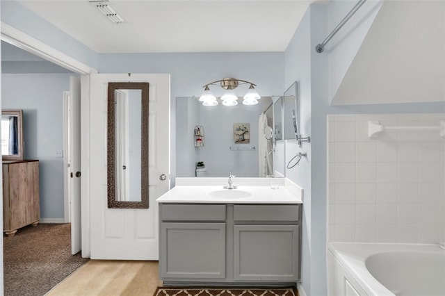 bathroom with vanity and shower / bathing tub combination