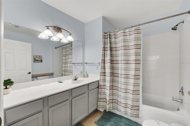 full bathroom with vanity, shower / bathtub combination with curtain, and toilet