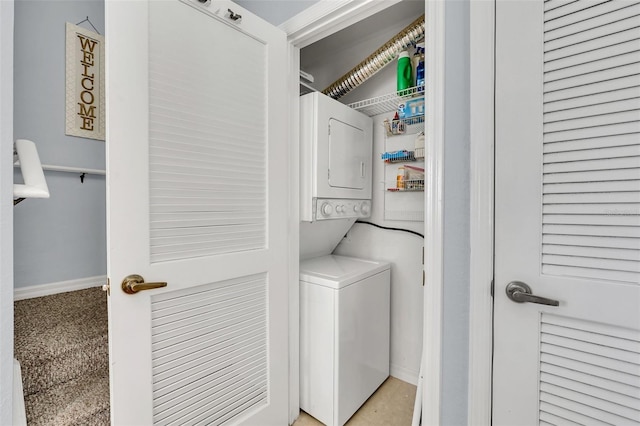 laundry room with stacked washer / drying machine