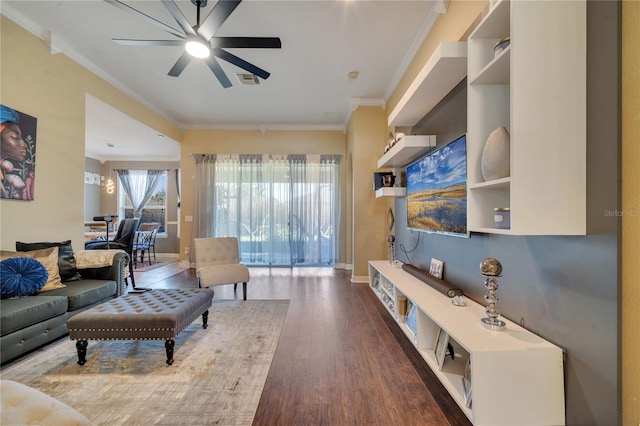 living room with dark hardwood / wood-style floors, ceiling fan, and ornamental molding