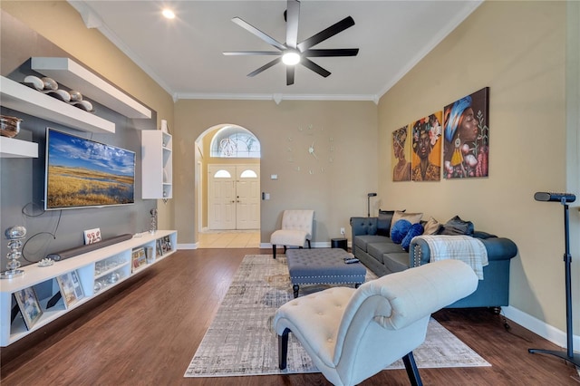 living room with hardwood / wood-style floors, ceiling fan, and ornamental molding