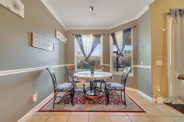 tiled dining area featuring crown molding