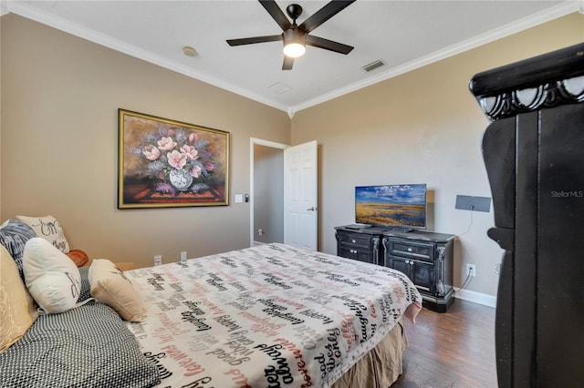 bedroom featuring ceiling fan, dark wood-type flooring, and ornamental molding