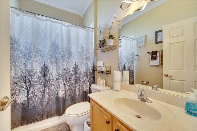 bathroom featuring vanity, toilet, ornamental molding, and walk in shower