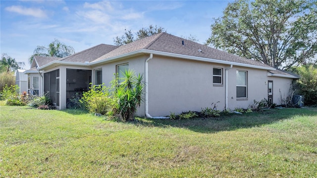 view of property exterior with a sunroom and a lawn