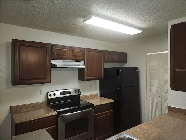 kitchen with black refrigerator, a textured ceiling, dark brown cabinetry, and stainless steel range with electric stovetop