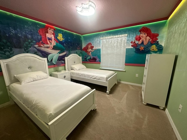 bedroom with carpet floors and a textured ceiling