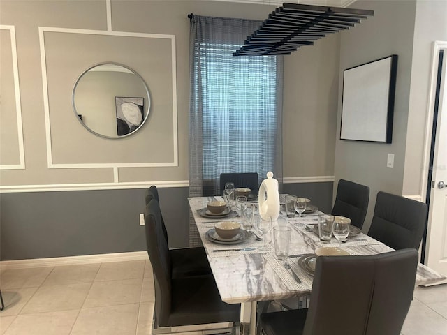 dining area featuring light tile patterned floors