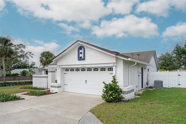 single story home with central AC unit, a garage, and a front lawn