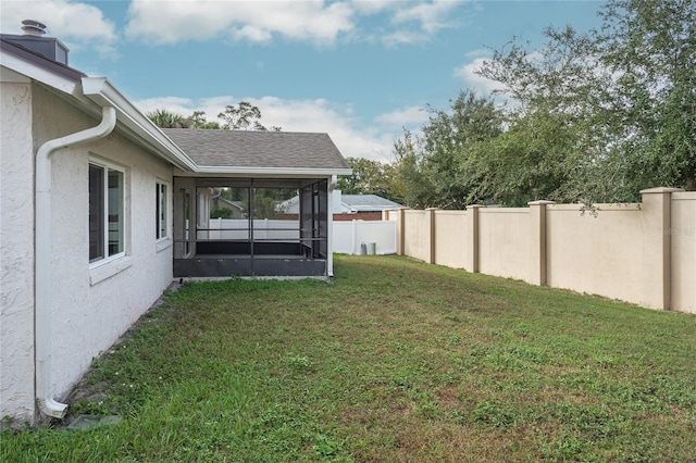 view of yard with a sunroom