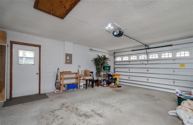 garage with electric panel and a garage door opener