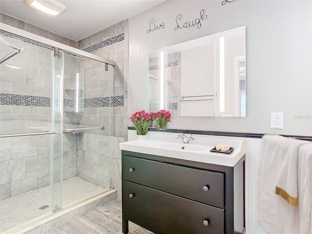 bathroom with vanity and walk in shower