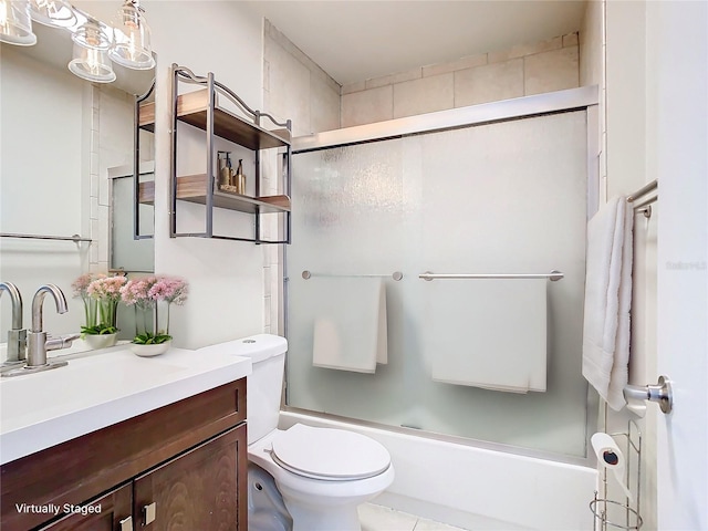 full bathroom with toilet, vanity, tile patterned floors, and enclosed tub / shower combo