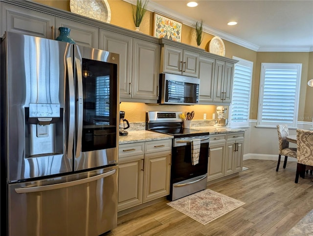 kitchen featuring stainless steel appliances, crown molding, light wood-type flooring, and light stone counters