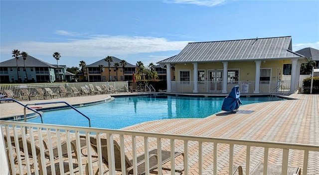 view of swimming pool with a patio