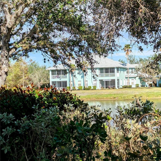 exterior space featuring a water view and a front yard