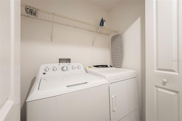 laundry room featuring washing machine and dryer