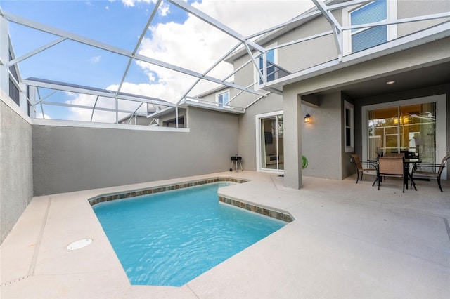 view of pool featuring a lanai and a patio