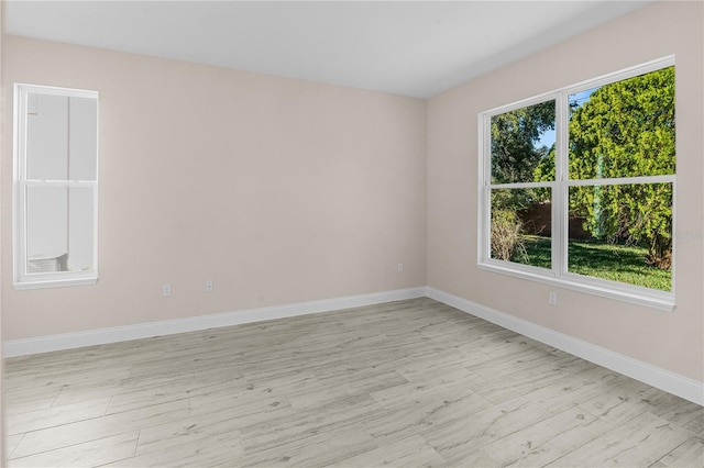 unfurnished room featuring light hardwood / wood-style flooring