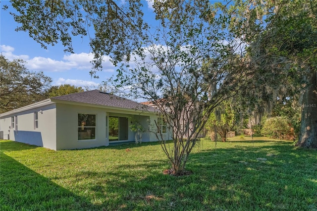 view of property exterior with a yard