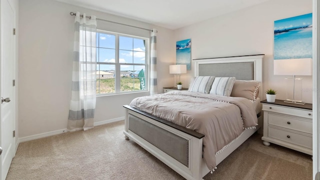 bedroom with light colored carpet