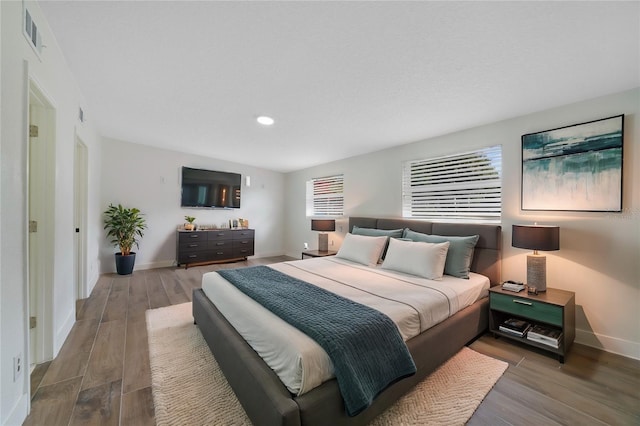 bedroom featuring wood-type flooring