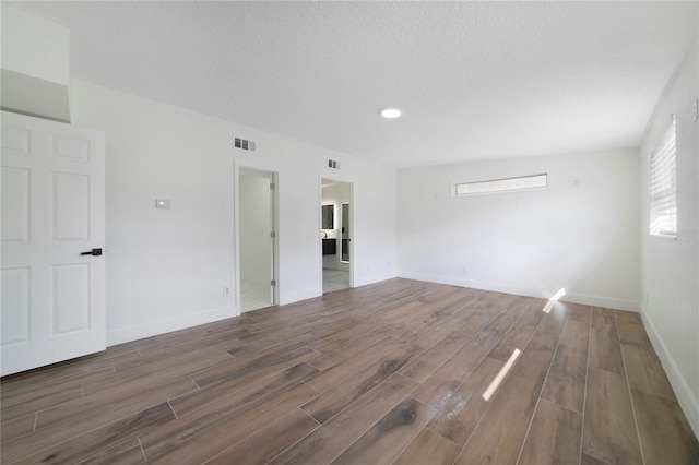 empty room with a textured ceiling