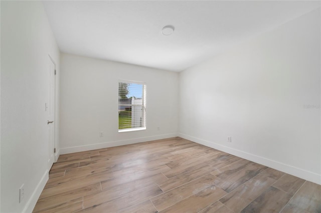 unfurnished room with light wood-type flooring