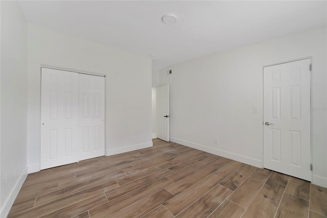 unfurnished bedroom featuring a closet