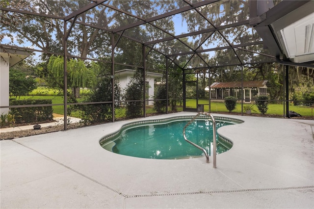 view of swimming pool featuring a lanai and a patio