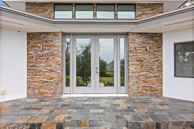 12550 Lakeshore Dr, Clermont, FL 34711 - property entrance with french doors and brick siding