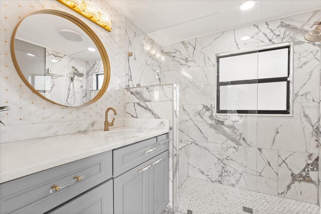 12550 Lakeshore Dr, Clermont, FL 34711 - bathroom featuring vanity, a marble finish shower, and tile walls