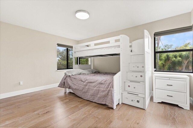 12550 Lakeshore Dr, Clermont, FL 34711 - bedroom with light wood-style flooring and baseboards