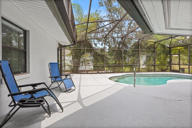 12550 Lakeshore Dr, Clermont, FL 34711 - outdoor pool featuring a patio area and glass enclosure