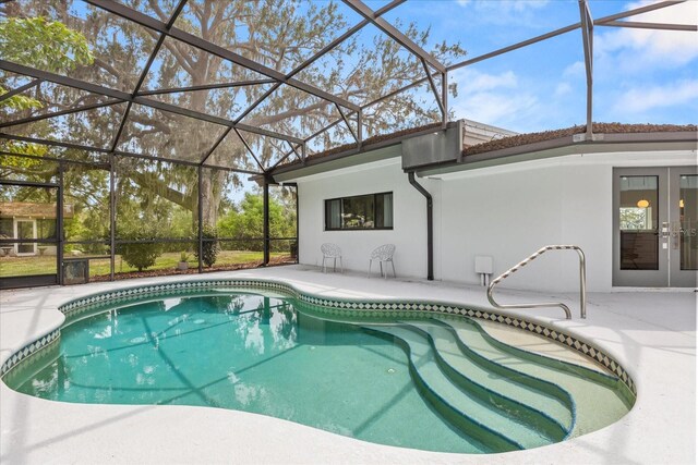 12550 Lakeshore Dr, Clermont, FL 34711 - swimming pool featuring a patio, french doors, and glass enclosure