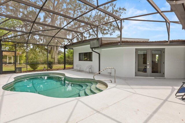 12550 Lakeshore Dr, Clermont, FL 34711 - swimming pool featuring french doors, a patio, and a lanai