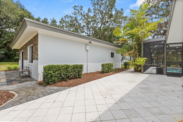 12550 Lakeshore Dr, Clermont, FL 34711 - view of patio featuring a lanai and an outdoor pool