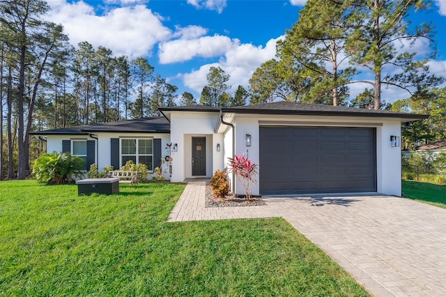 ranch-style home featuring a front yard and a garage