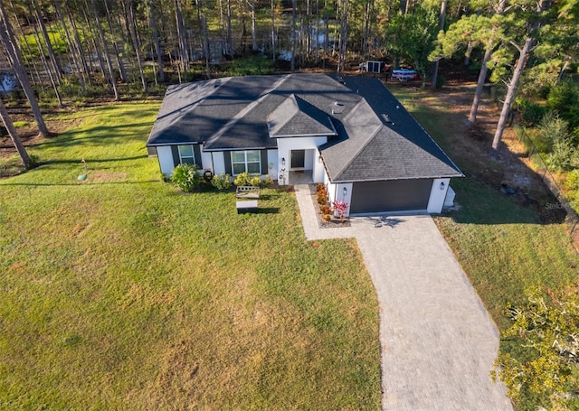 view of front facade featuring a garage and a front lawn