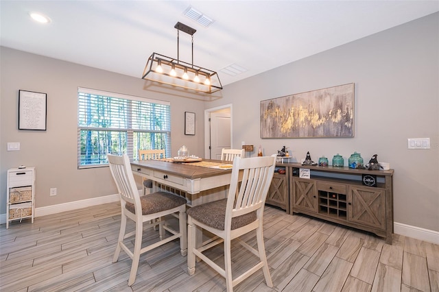 dining space featuring light hardwood / wood-style flooring