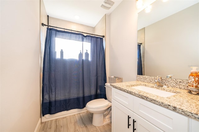 full bathroom with vanity, hardwood / wood-style flooring, toilet, and shower / bathtub combination with curtain