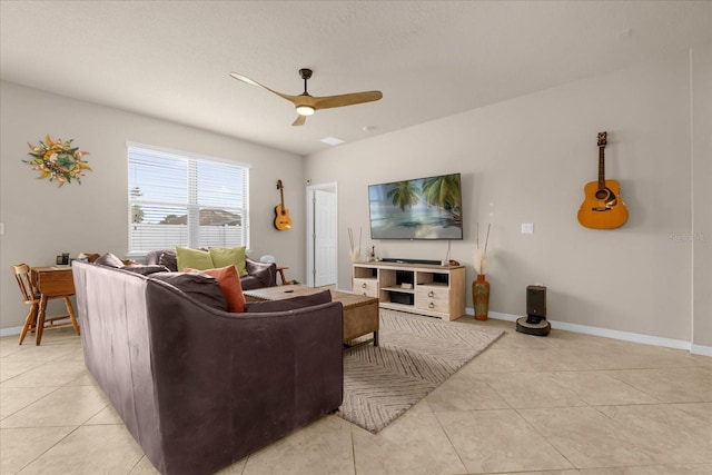 tiled living room featuring ceiling fan